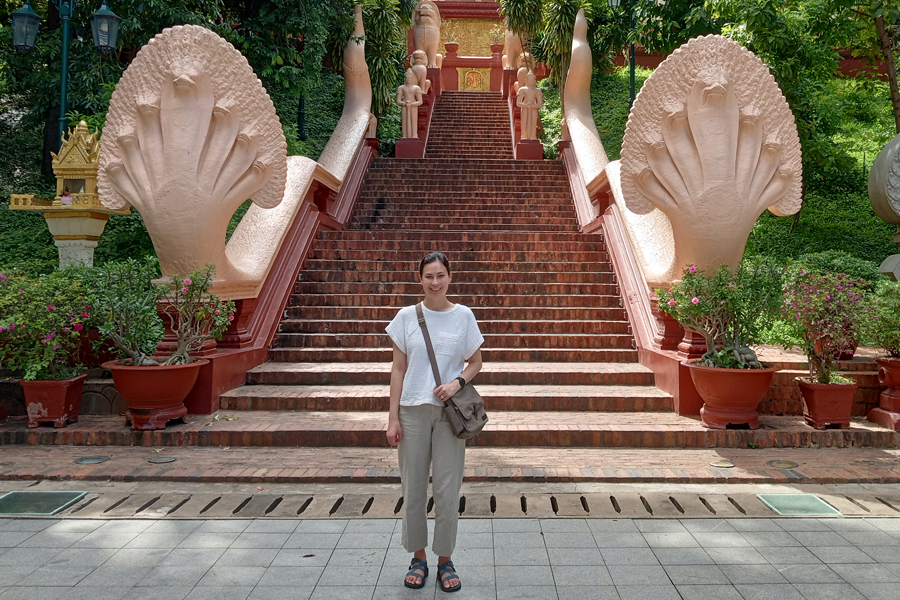 girl in front of steps in cambodia