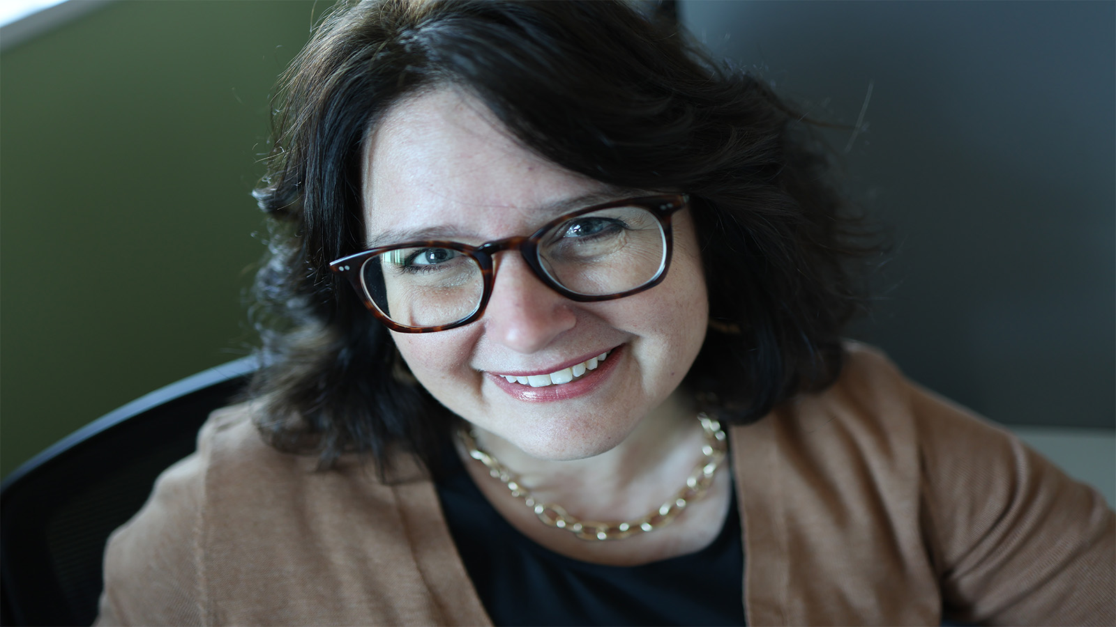 Dr. Julie deGraffenried smiles at the camera in a headshot