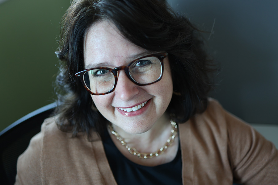 Dr. Julie deGraffenried faces the camera and smiles in a headshot
