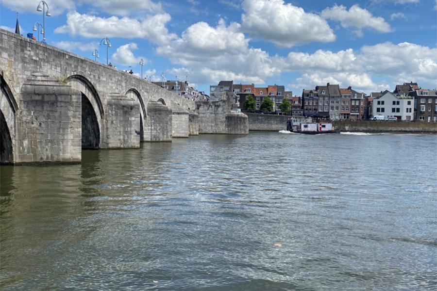A view of the Sint Servaasbrug Bridge in Maastricht and the houses along the river
