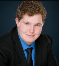 young man in suit headshot