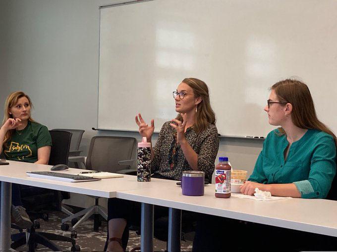 women talks seated to peers