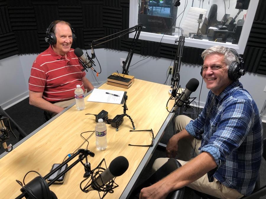 Two faculty in the recording studio.