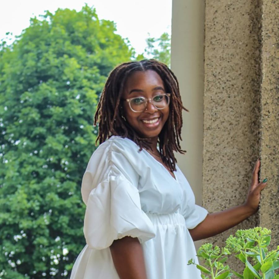 Woman in glasses smiling at the camera