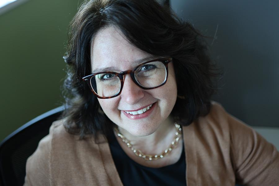 Dr. Julie deGraffenried faces the camera and smiles in a headshot