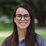 Dr. Marilia Corrêa faces the camera smiling
