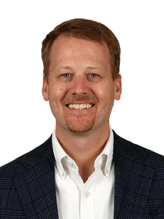 Dr. Robert Elder smiles at the camera in a headshot