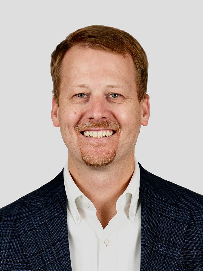 Dr. Robert Elder smiles at the camera in a headshot